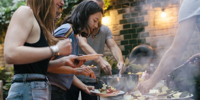 people having a barbeque outdoors