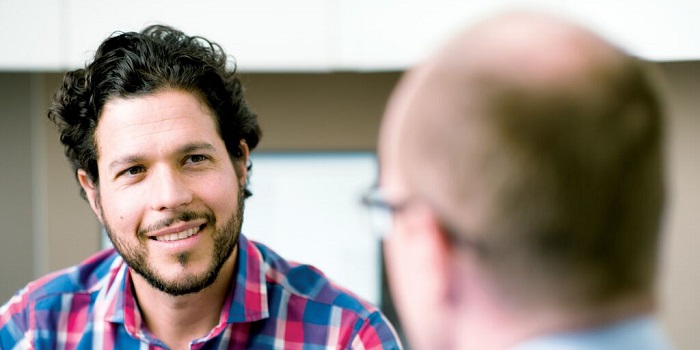 a man talking to a doctor