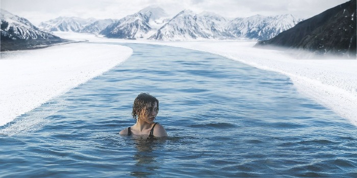woman swimming in ice water