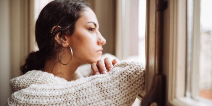 person gazing out of the window