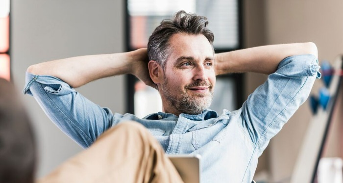 person looking outdoors with a pensive expression
