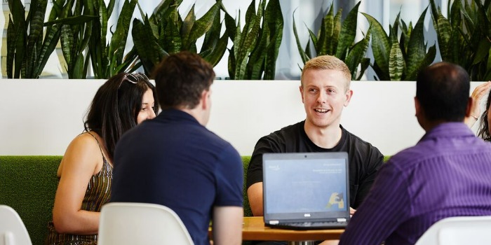 people sitting down for a meeting in the office