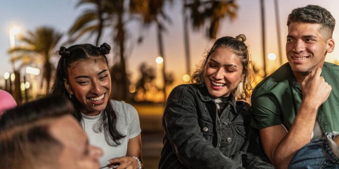 group of young people chatting outdoors