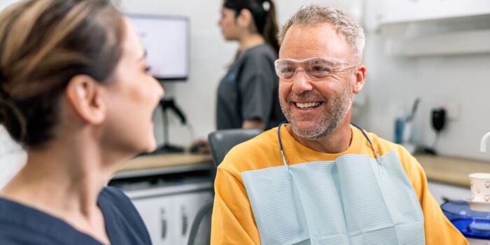 two dentist colleagues smiling at work