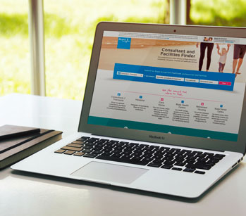 laptop on table with bupa website open
