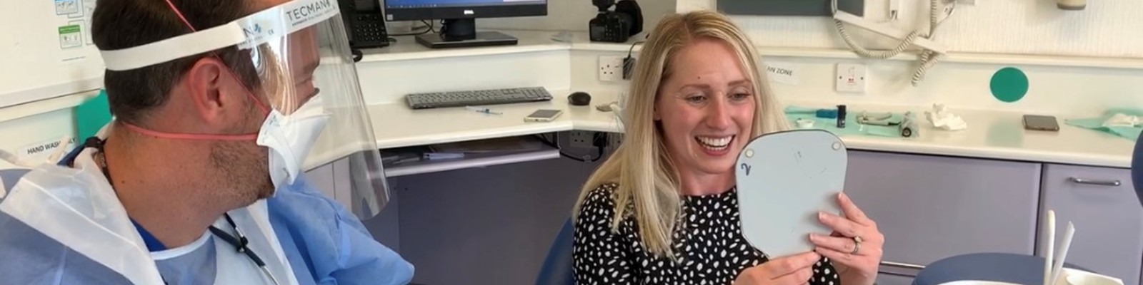 Carly looking at her results with Bupa Dental Care Gloucester Road