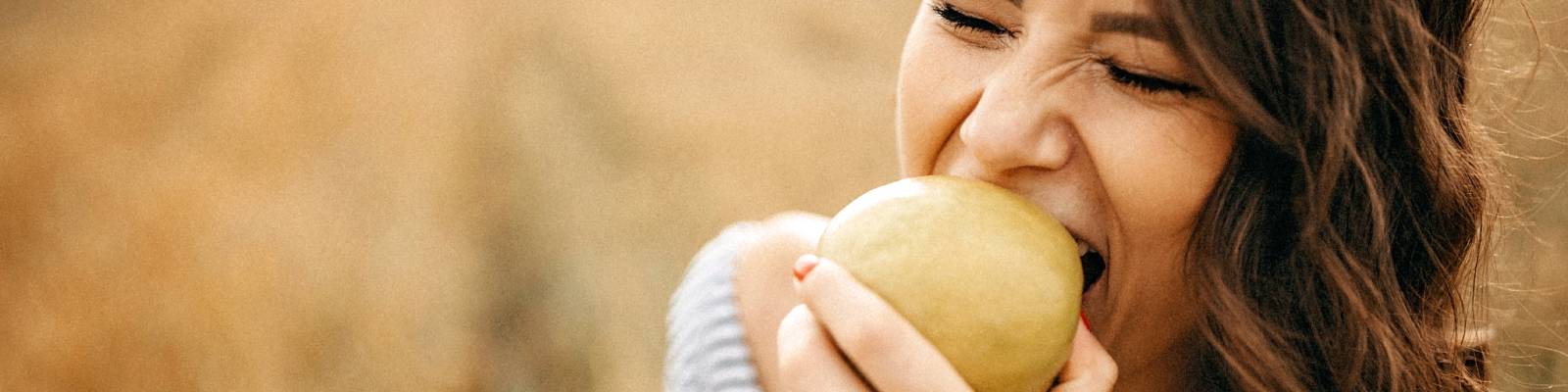 Woman eating an apple