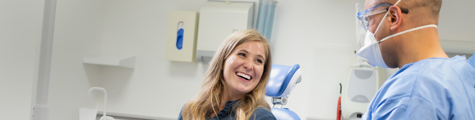 Dentist and patient in practice room